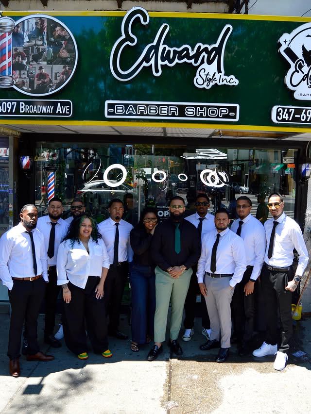Edward Style Barbershop team in front of the storefront, 4097 Broadway NYC