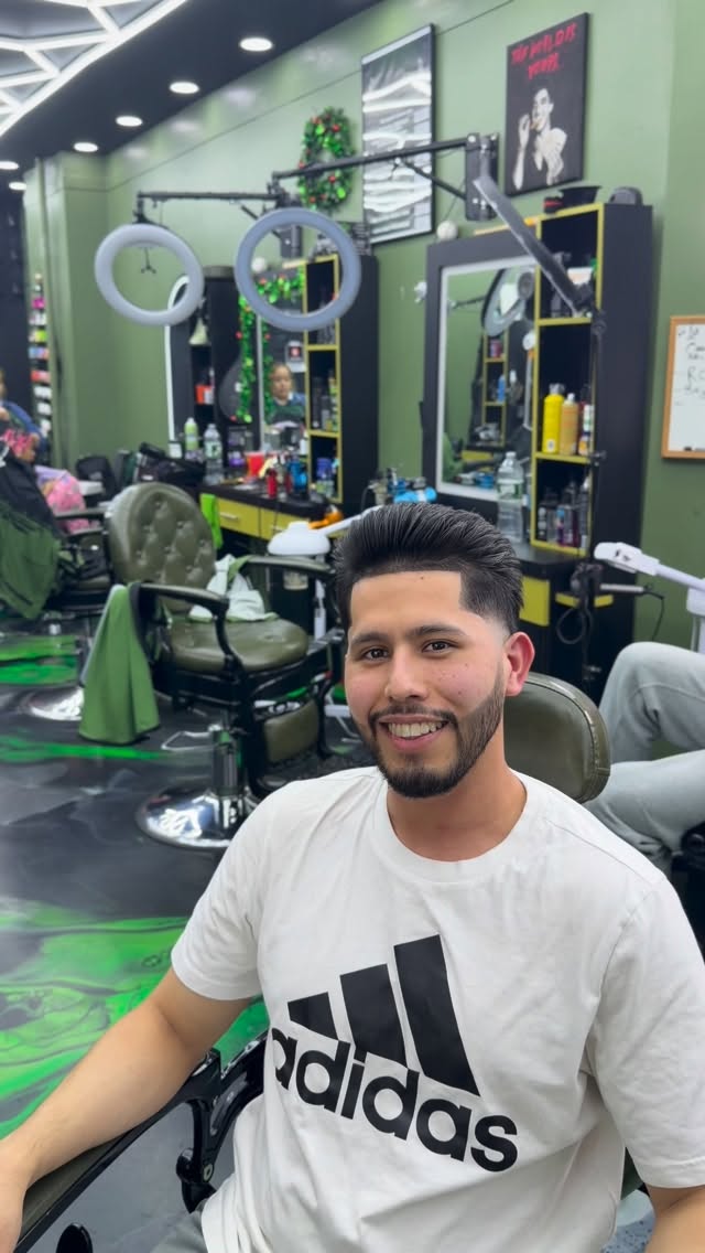 Smiling client in the chair at Edward Style Barbershop NYC